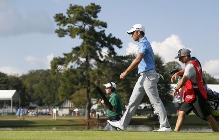 Sep 24, 2017; Atlanta, GA, USA; Xander Schauffele walks off the 16th tee during the final round of the Tour Championship golf tournament at East Lake Golf Club. Mandatory Credit: Brett Davis-USA TODAY Sports