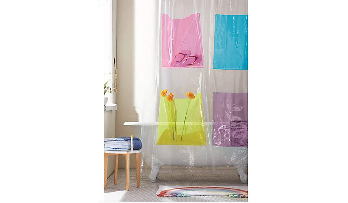 Clear shower curtain with four neon colored pockets