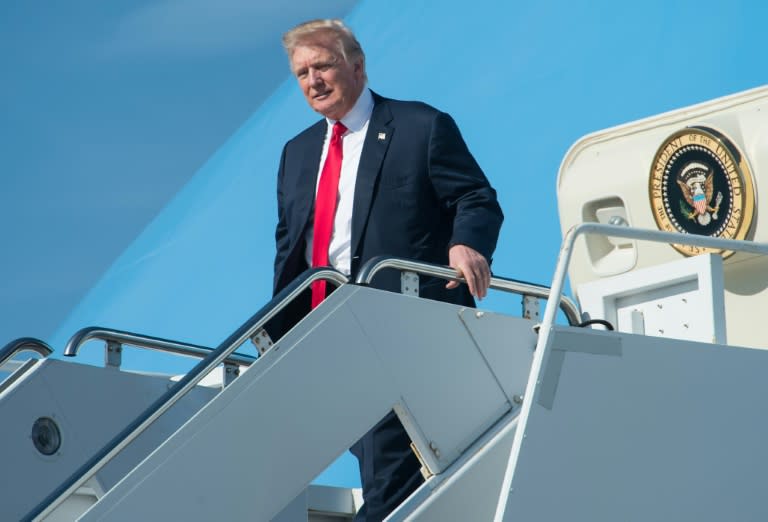 US President Donald Trump arrives at Palm Beach International Airport in Florida to spend the weekend at his Mar-a-Lago resort on February 17, 2017