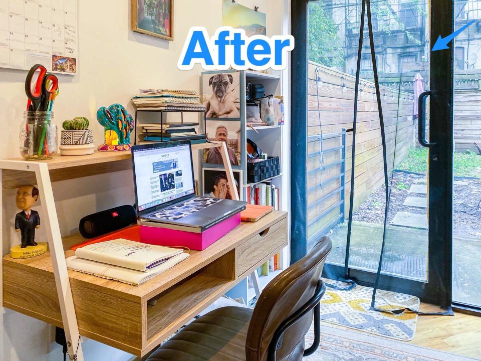 Blue text says "after" at the top of a photo of a home office with a wood desk holding papers, a laptop, and decor. Behind it is a windowed door.