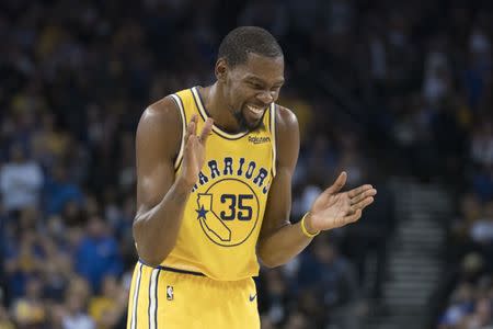 FILE PHOTO: October 24, 2018; Oakland, CA, USA; Golden State Warriors forward Kevin Durant (35) celebrates against the Washington Wizards during the third quarter at Oracle Arena. Mandatory Credit: Kyle Terada-USA TODAY Sports