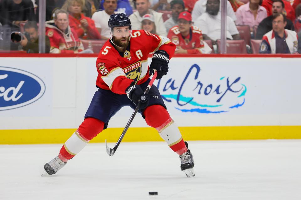 May 6, 2024; Sunrise, Florida, USA; Florida Panthers defenseman Aaron Ekblad (5) moves the puck against the Boston Bruins during the second period in game one of the second round of the 2024 Stanley Cup Playoffs at Amerant Bank Arena.