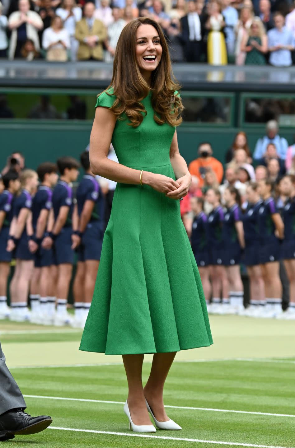 <p>The Duchess coordinated with Wimbledon's grass courts when she <a href="https://www.townandcountrymag.com/society/tradition/a36987867/kate-middleton-prince-william-wimbledon-ladies-final-photos-2021/" rel="nofollow noopener" target="_blank" data-ylk="slk:attended the ladies’ singles final;elm:context_link;itc:0;sec:content-canvas" class="link ">attended the ladies’ singles final</a>. To present the trophy, Kate chose a Kelly green, pleated Emilia Wickstead dress and white pointed-toe pumps. </p>