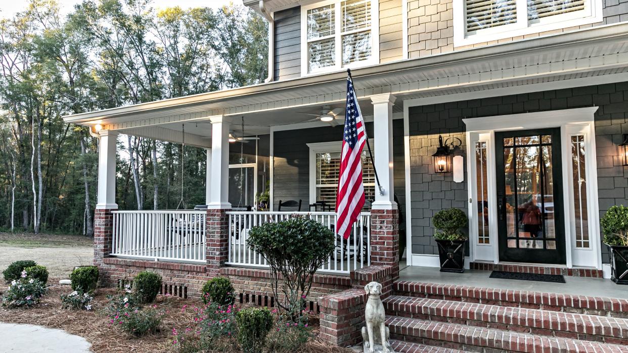  Flag code rules: American flag hung outside house  