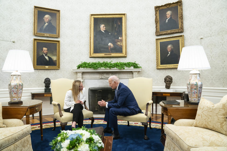 FILE - President Joe Biden meets with Italian Premier Giorgia Meloni in the Oval Office of the White House, Thursday, July 27, 2023, in Washington. When Giorgia Meloni took office a year ago as the first far-right premier in Italy's post-war history, concern was palpable abroad about the prospect of democratic backsliding and resistance to European Union rules. But since being sworn in as premier on Oct. 22, 2022, Meloni has confounded Western skeptics. (AP Photo/Evan Vucci, File)