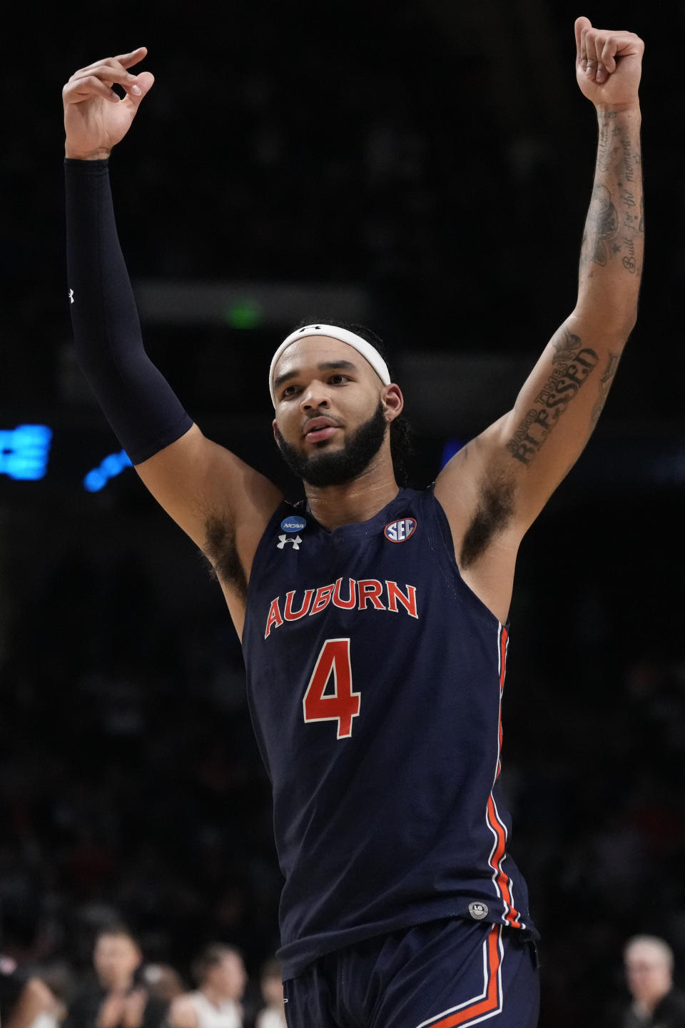Auburn forward Johni Broome raises his arms as Auburn pulls ahead of Iowa during the second half of a first-round college basketball game in the men's NCAA Tournament in Birmingham, Ala., Thursday, March 16, 2023. Auburn won 83-75. (AP Photo/Rogelio V. Solis)
