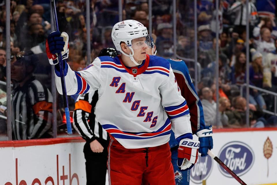 Mar 28, 2024; Denver, Colorado, USA; New York Rangers right wing Kaapo Kakko (24) celebrates after his goal in the third period against the Colorado Avalanche at Ball Arena.