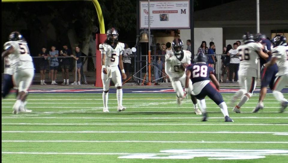 Central freshman running back Jareal Albert goes for extra yardage against San Joaquin Memorial on Friday, Aug. 25, 2023.