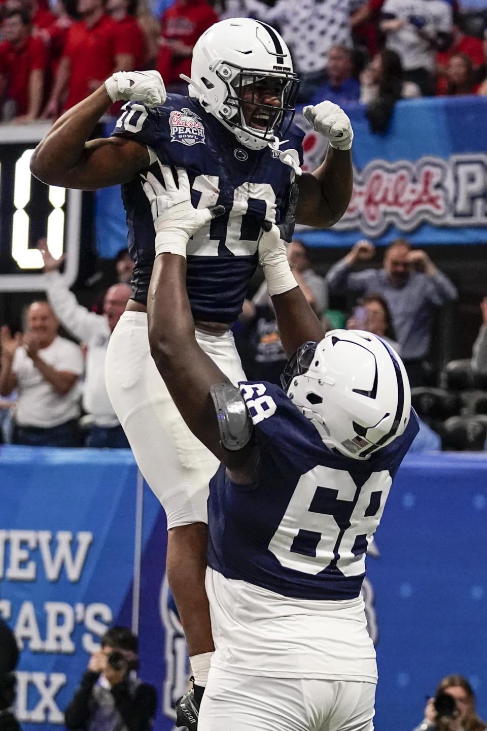 Penn State running back Nicholas Singleton (10) celebrates his touchdown against Mississippi during the first half of the Peach Bowl NCAA college football game, Saturday, Dec. 30, 2023, in Atlanta. (AP Photo/Brynn Anderson)