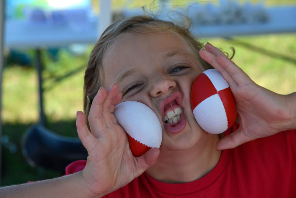 A guest enjoys circus juggling balls at Payomet Performing Arts Center.