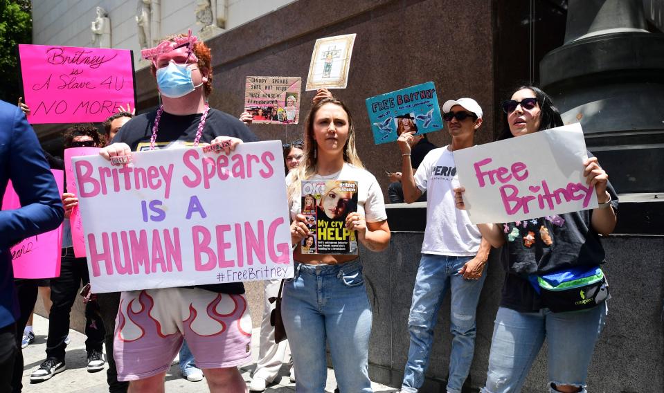 Fans and supporters hold "Free Britney" signs as they gather outside the County Courthouse in Los Angeles, California on June 23, 2021, during a scheduled hearing in Britney Spears' conservatorship case<span class="copyright">AFP via Getty Images</span>