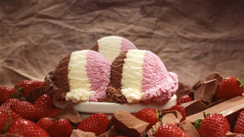 Three Neapolitan ice cream scoops