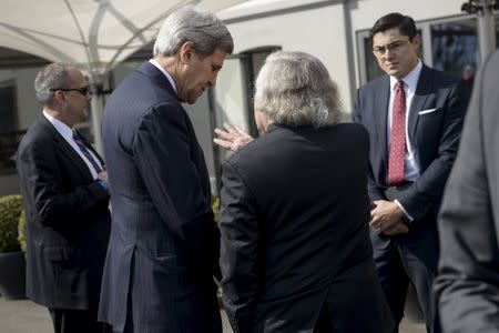 US Secretary of State John Kerry (centre L) and US Secretary of Energy Ernest Moniz talk in the street during a lunch break in negotiations with Iranian officials on March 27, 2015 in Lausanne. REUTERS/Brendan Smialowski/Pool