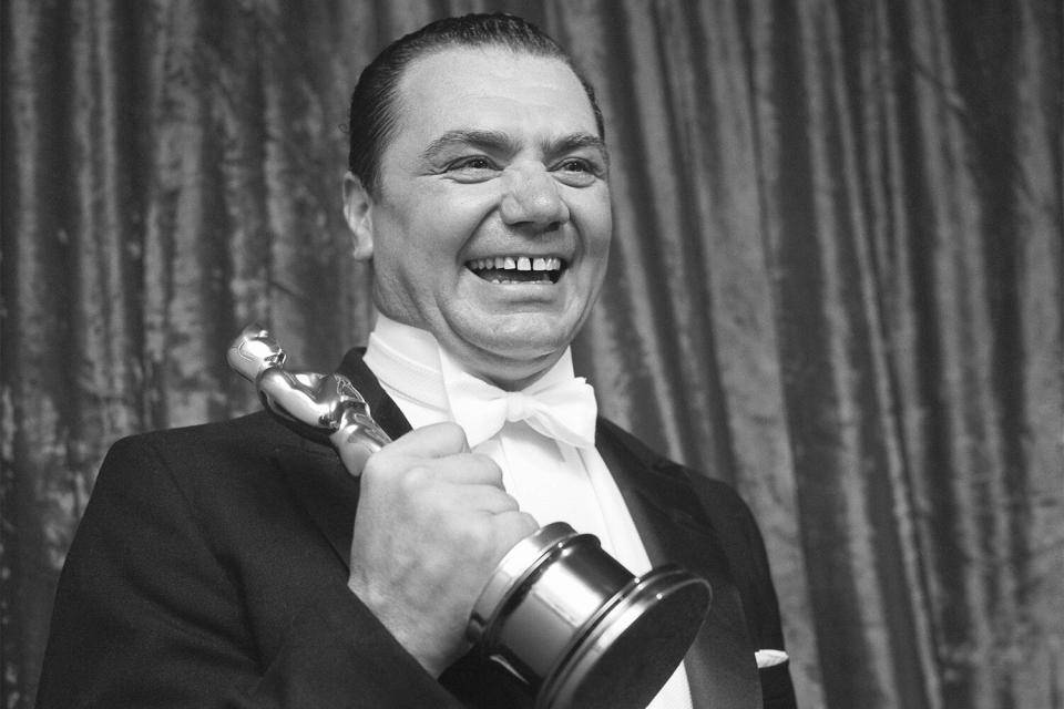 LOS ANGELES - MARCH 21: Actor Ernest Borgnine backstage at the Academy Awards ceremony after winning the Oscar for Best Actor in a leading role for the film 'Marty' on March 21, 1956, at the RKO Pantages Theatre in Los Angeles, California. (Photo by Earl LeafMichael Ochs Archives/Getty Images)