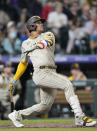 San Diego Padres' Juan Soto follows the flight of his solo home run off Colorado Rockies relief pitcher Carlos Estevez in the eighth inning of a baseball game Friday, Sept. 23, 2022, in Denver. (AP Photo/David Zalubowski)