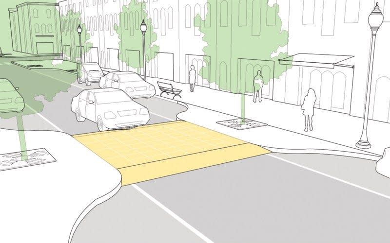 A rendering shows a speed table, a flat-topped speed hump designed to limit the speed at which a vehicle can go over it. The Village of Greendale will be installing a speed table on Broad Street between Northway and Schoolway to improve pedestrian safety.