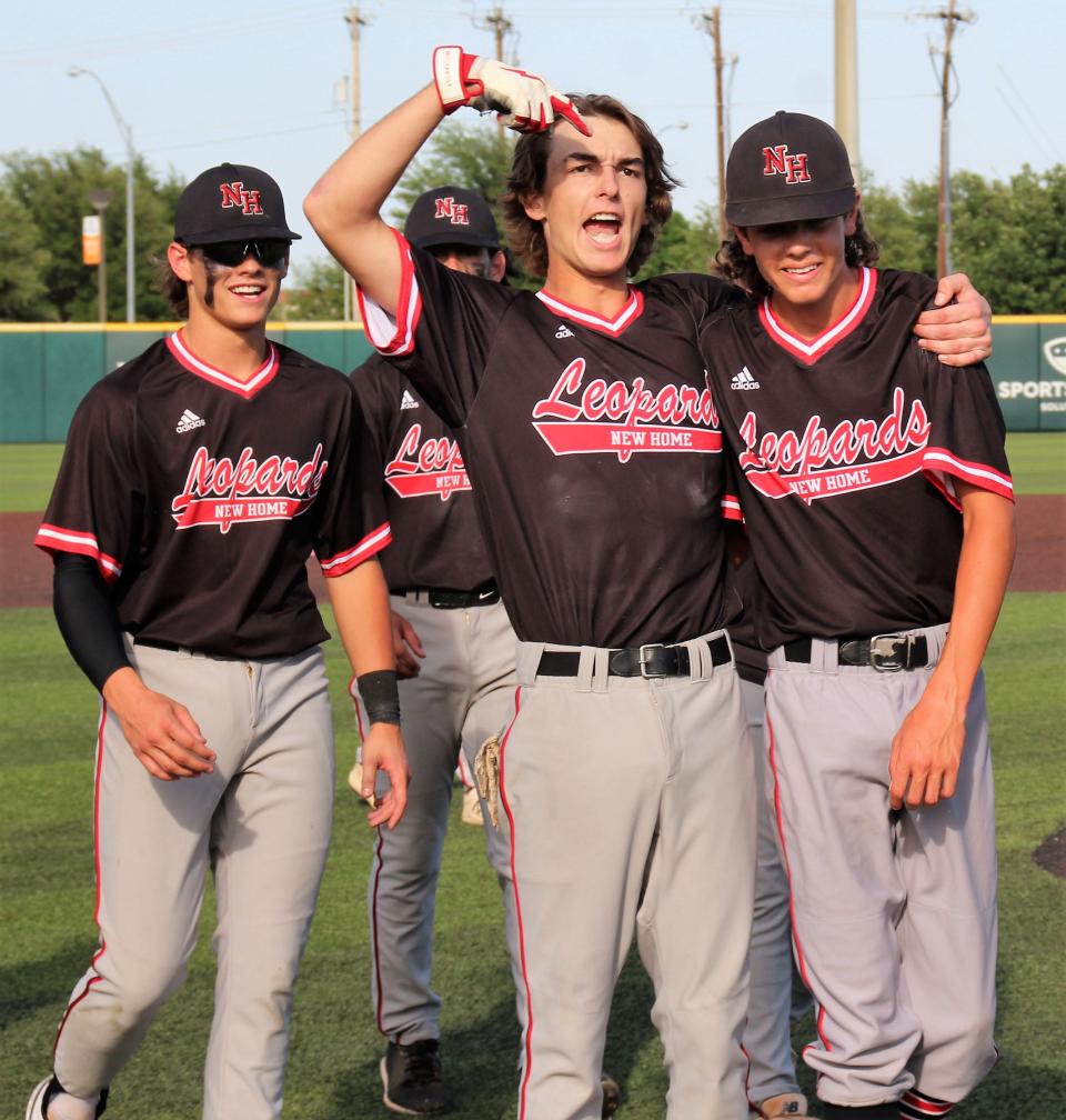 Teammates pump it up for pitcher Owen Morris, right, who nailed down the win in Game of Saturday's playoff against Anson at ACU.