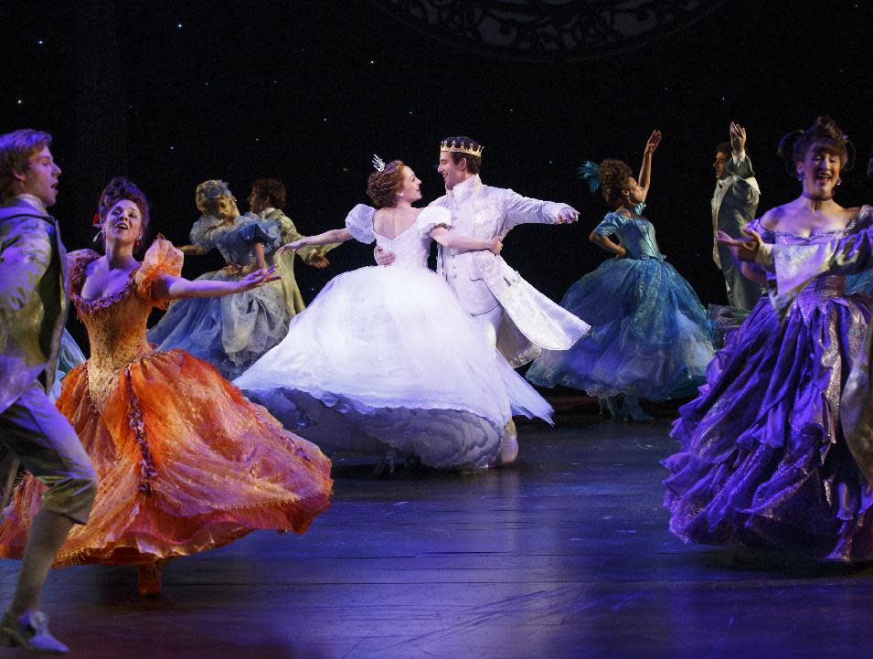 This theater image released by Sam Rudy Media Relations shows Laura Osnes as Cinderella, center left, dancing with Santino Fontana as the Prince, during a performance of "Rodgers + Hammerstein's Cinderella on Broadway." (AP Photo/Sam Rudy Media Relations, Carol Rosegg)