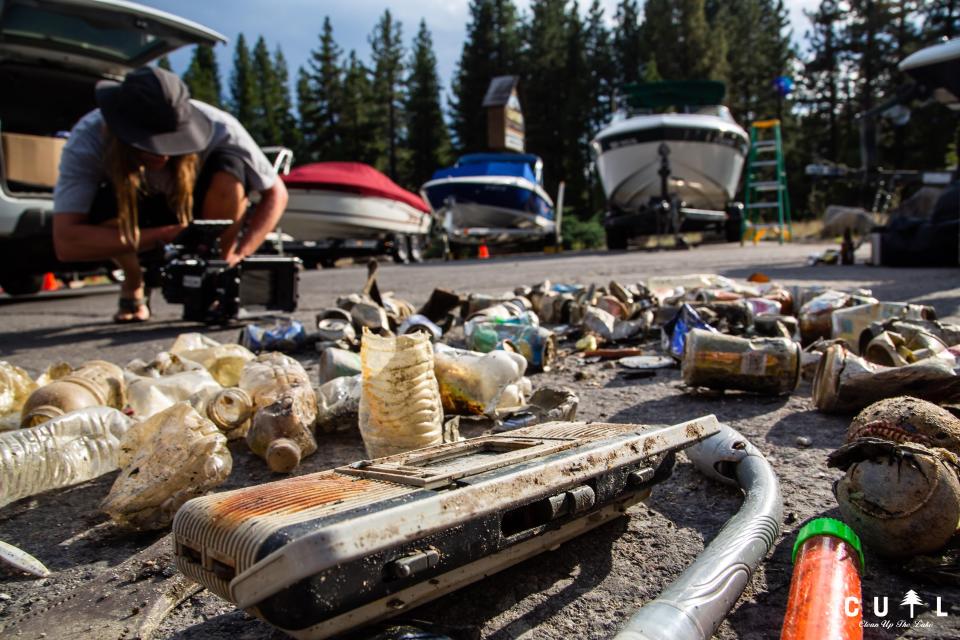 This photo provided by Clean Up The Lake shows a pile of trash taken from the bottom of Lake Tahoe by a group of scuba divers during a cleanup on Friday, May 14, 2021. The dive team of professionals and volunteers spearheaded by Clean Up The Lake, began an extraordinary effort to recover trash that has been accumulating untouched under the surface of the lake for decades. (Clean Up The Lake via AP)