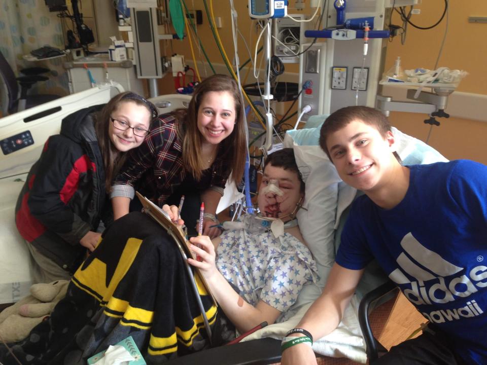 Carson Molle is shown in the hospital with his siblings, from left, Evy, Maddy and Josh.