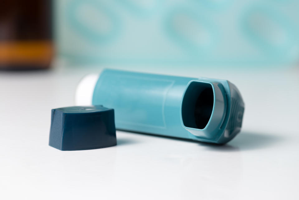 Close up of an asthma inhaler.