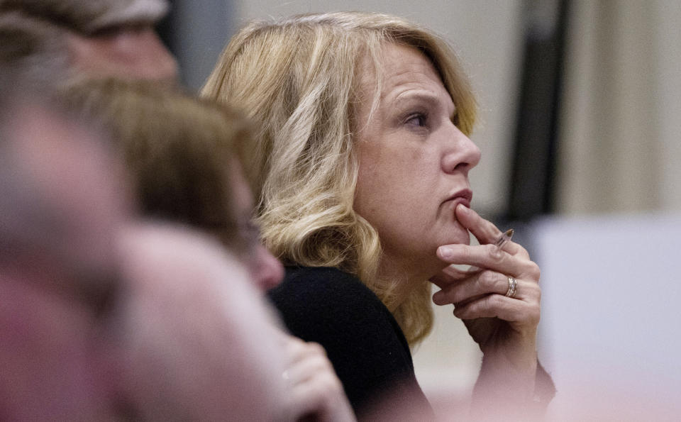 Beth Harris, the wife of Mark Harris, a Republican candidate in North Carolina's 9th Congressional race, listens to testimony during the third day of a public evidentiary hearing on the 9th Congressional District voting irregularities investigation Wednesday, Feb. 20, 2019, at the North Carolina State Bar in Raleigh, N.C. (Travis Long//The News & Observer via AP, Pool)