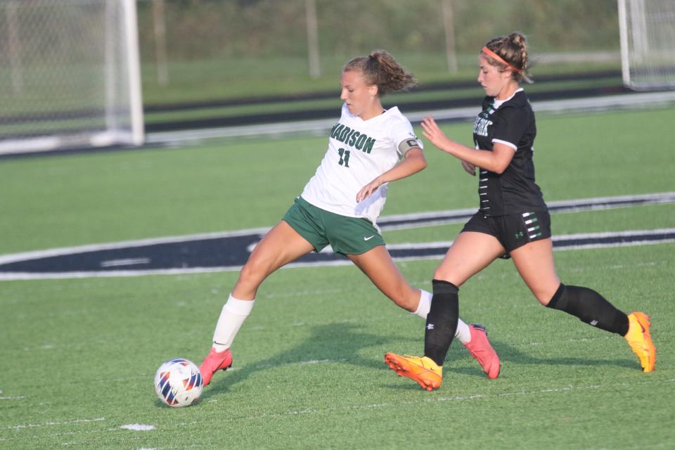 Madison's Natalee Back and Clear Fork's Annika Labaki battle for position during a 1-1 tie on Friday night.