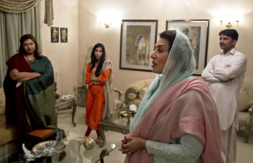 In this Friday, Dec. 13, 2013 photo, Breast cancer survivor and prominent Pakistani politician Fehmida Mirza, second right, speaks with guests at her residence in Islamabad, Pakistan. Mirza and groups are trying to draw attention to breast cancer and break the silence surrounding it. (AP Photo/B.K. Bangash)