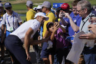 Tennis player Novak Djokovic poses for a photograph with a you fan during an all stars golf match between Team Colin Montgomerie and Team Cory Pavin at the Marco Simone Golf Club in Guidonia Montecelio, Italy, Wednesday, Sept. 27, 2023. The Ryder Cup starts Sept. 29, at the Marco Simone Golf Club. (AP Photo/Andrew Medichini)