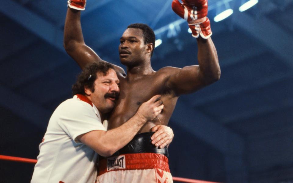  Larry Holmes victorious with trainer Richie Giachetti after winning fight vs Earnie Shavers at Caesars Palace. Larry Holmes won the WBC heavyweight title by a TKO 11. - Manny Millan /Sports Illustrated/Getty Images