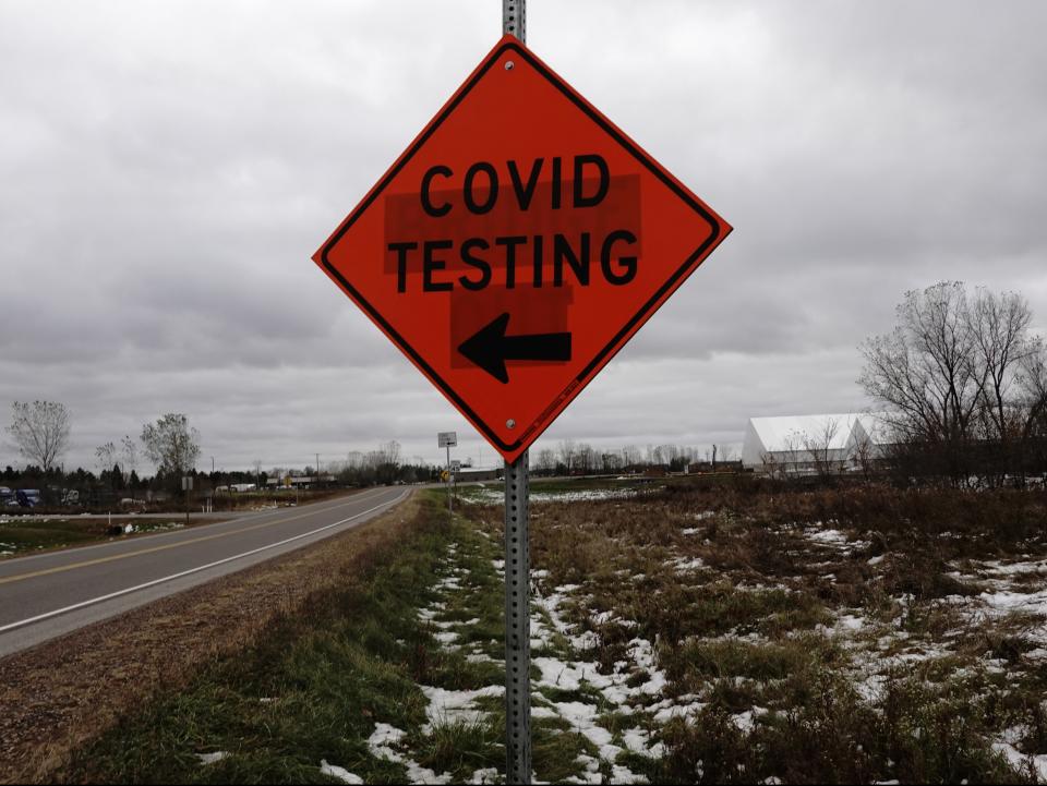 A sign for a Covid-19 drive-thru testing site alongside US Highway 12 is seen as the coronavirus outbreak continues in Eau Claire, Wisconsin (REUTERS)