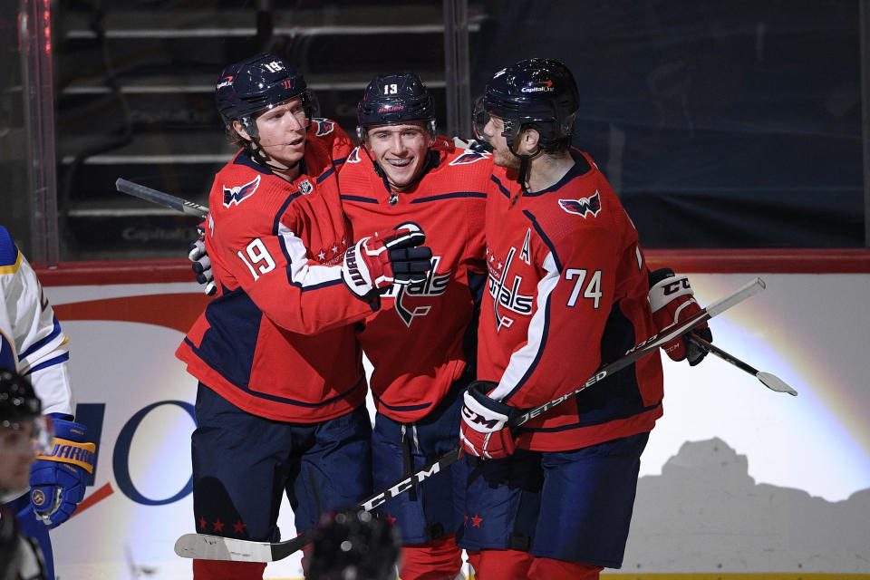 Washington Capitals center Nicklas Backstrom (19) celebrates his goal with left wing Jakub Vrana, center, and defenseman John Carlson (74) during the first period of an NHL hockey game, Friday, Jan. 22, 2021, in Washington. (AP Photo/Nick Wass)