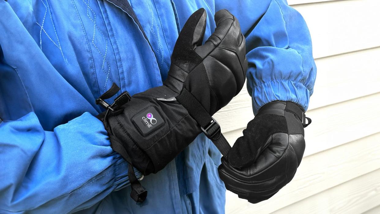 adjusting buckle on black heated gloves