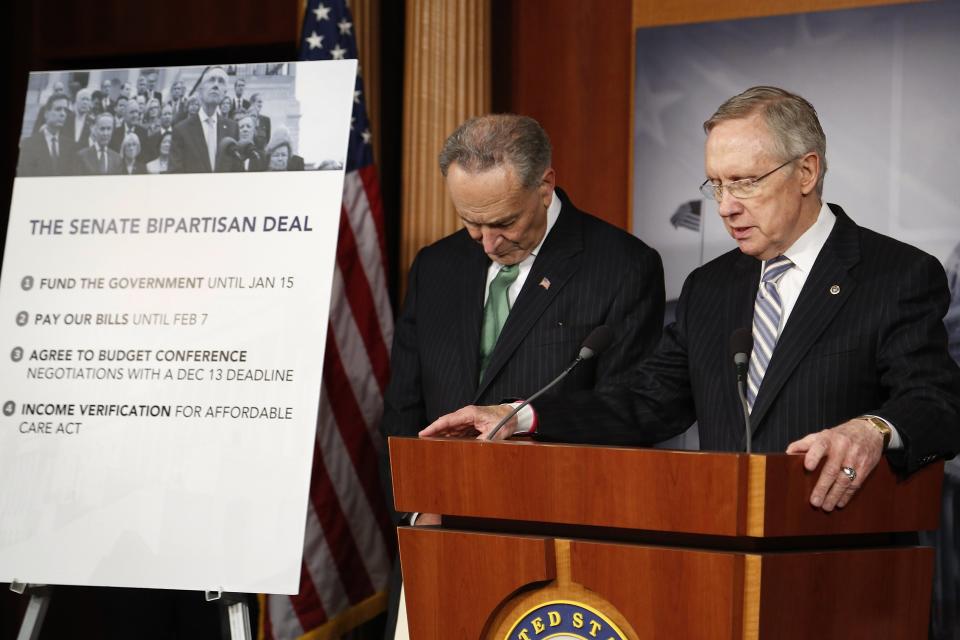 U.S. Senator Charles Schumer (D-NY) (L) and Senate Majority Leader Harry Reid (D-NV) appear at a news conference after bipartisan passage of stopgap budget and debt legislation at the U.S. Capitol in Washington, October 16, 2013. The U.S. Senate approved a deal on Wednesday to end a political crisis that partially shut down the federal government and brought the world's biggest economy to the edge of a debt default that could have threatened financial calamity. REUTERS/Jonathan Ernst (UNITED STATES - Tags: POLITICS BUSINESS)