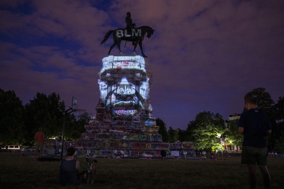 richmond, virginia june 18 george floyd's image is projected on the robert e lee monument as people gather around on june 18, 2020 in richmond, virginia richmond circuit court judge bradley cavedo ruled on thursday to indefinitely extended an injunction preventing the virginia governor from removing a historic statue of confederate gen robert e lee from richmond's famed monument avenue photo by tasos katopodisgetty images