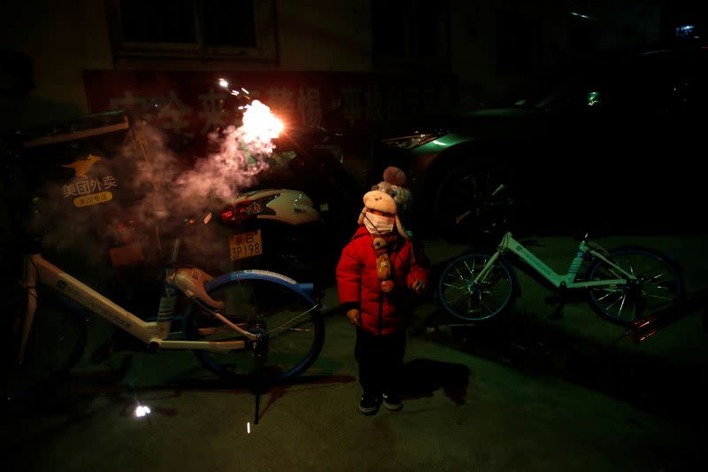 The Wider Image: 'I've let them down': Beijing's migrant workers miss family reunions on Lunar New Year