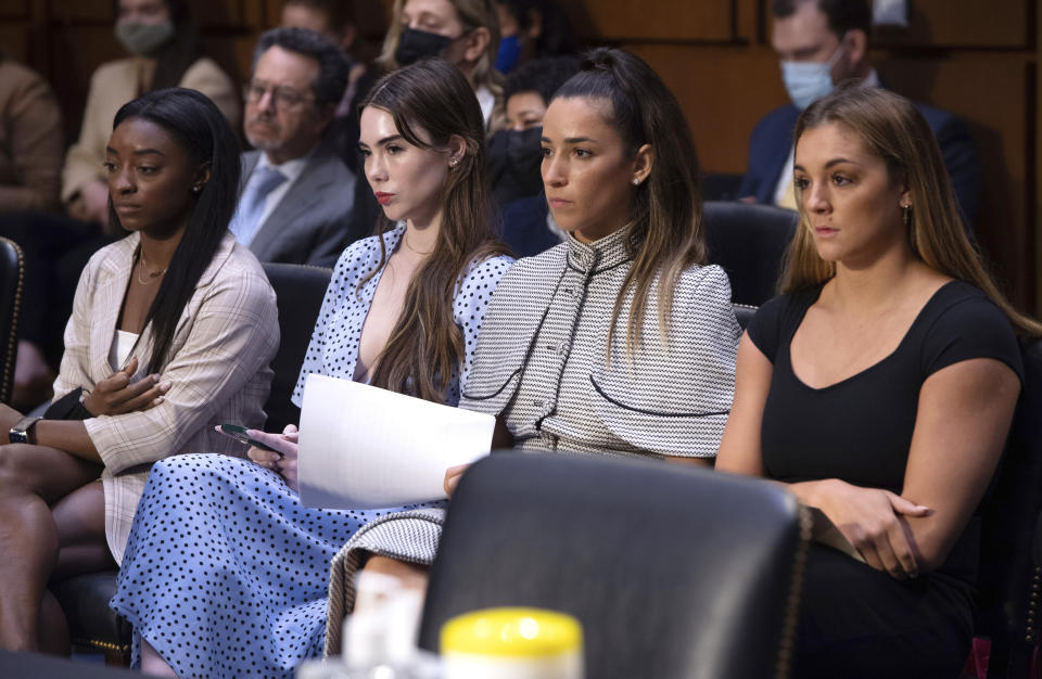 FILE - United States gymnasts from left, Simone Biles, McKayla Maroney, Aly Raisman and Maggie Nichols, arrive to testify during a Senate Judiciary hearing about the Inspector General's report on the FBI's handling of the Larry Nassar investigation on Capitol Hill, Sept. 15, 2021, in Washington. The FBI has reached out to attorneys representing Olympic gold medalist Simone Biles and other women who say they were sexually assaulted by Larry Nassar to begin settlement talks in the $1 billion claim they brought against the federal government, according to three people familiar with the matter. (Saul Loeb/Pool via AP, File)