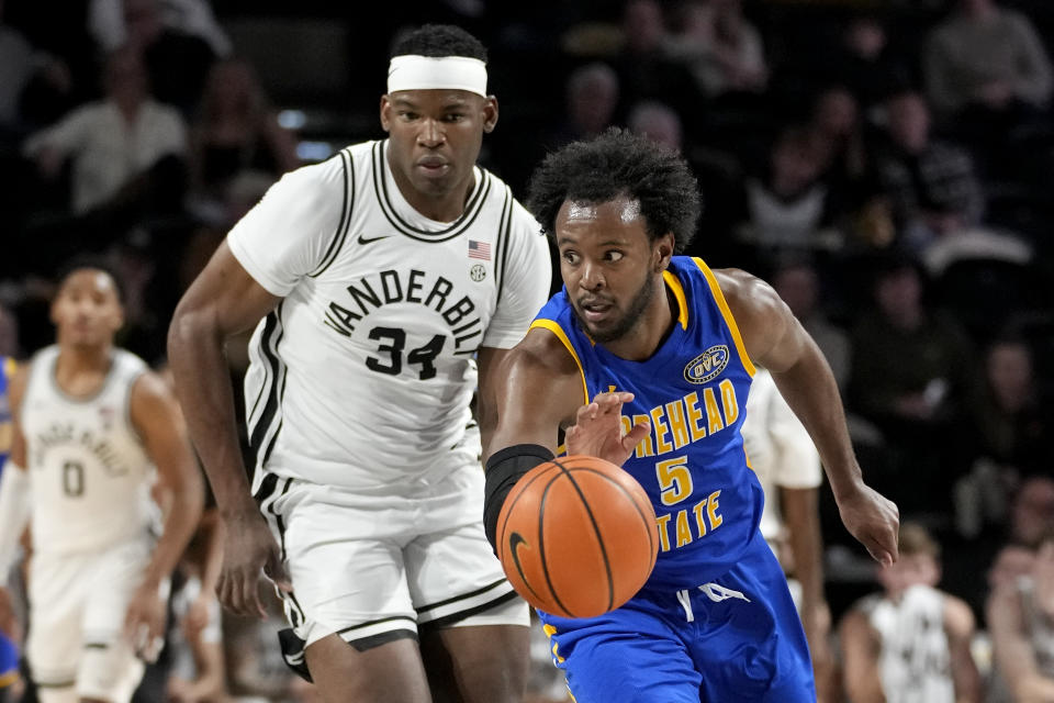 Morehead State's Branden Maughmer (5) heads down the court ahead of Vanderbilt forward Lee Dort (34) in the second half of an NCAA college basketball game Friday, Nov. 18, 2022, in Nashville, Tenn. (AP Photo/Mark Humphrey)