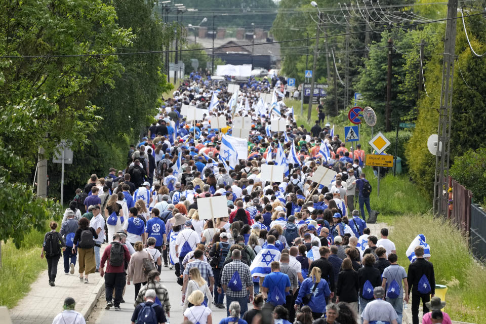 People attend the annual Holocaust remembrance event, the "March of the Living" in memory of the six million Holocaust victims in Oswiecim, Poland, Monday, May 6, 2024. The event comes amid the dramatic backdrop of the violence of the Israel-Hamas war after the Oct. 7 Hamas attack, the deadliest violence against Jews since the Holocaust, and as pro-Palestinian protests sweep U.S. campuses. (AP Photo/Czarek Sokolowski)