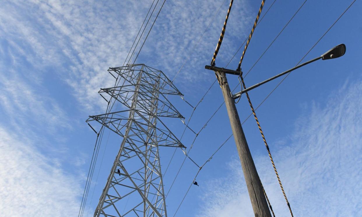 <span>The majority of residential customers can expect power price cuts of between 0.4% to 7.1% under the regulator’s draft default market offer.</span><span>Photograph: Mick Tsikas/AAP</span>
