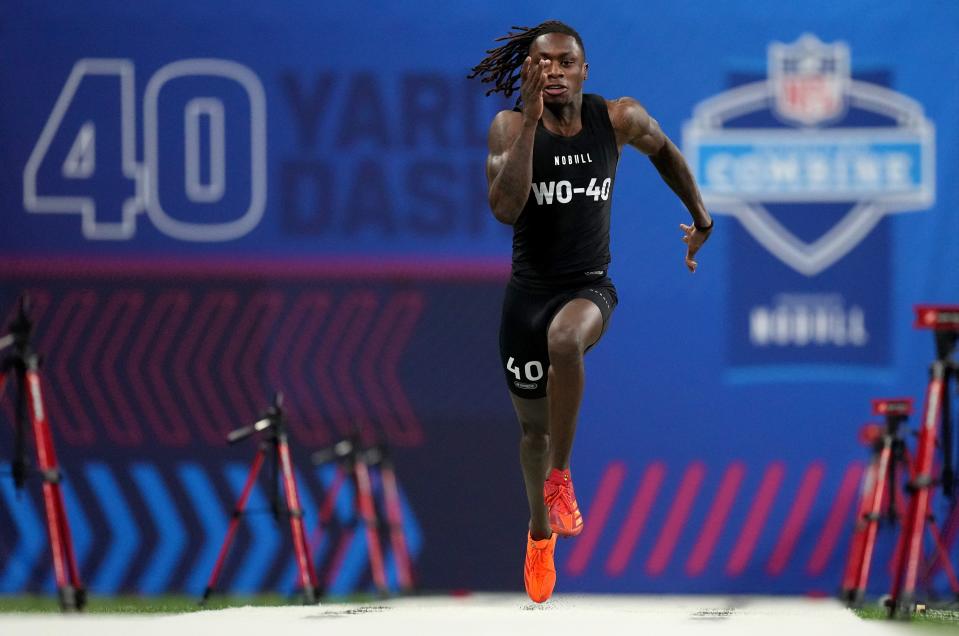 Texas wide receiver Xavier Worthy turned his record 4.21 in the 40-yard dash at the NFL scouting combine into a first-round selection in the NFL draft by Kansas City, where he'll be catching passes from Patrick Mahomes.