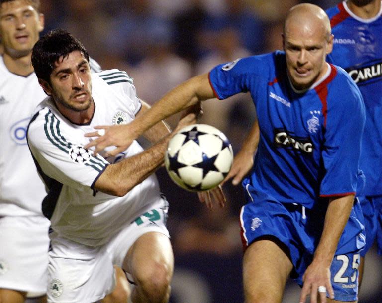 File photo of former Rangers star Henning Berg in a tussle with Panathinaikos' Michalis Kostantinou for the ball