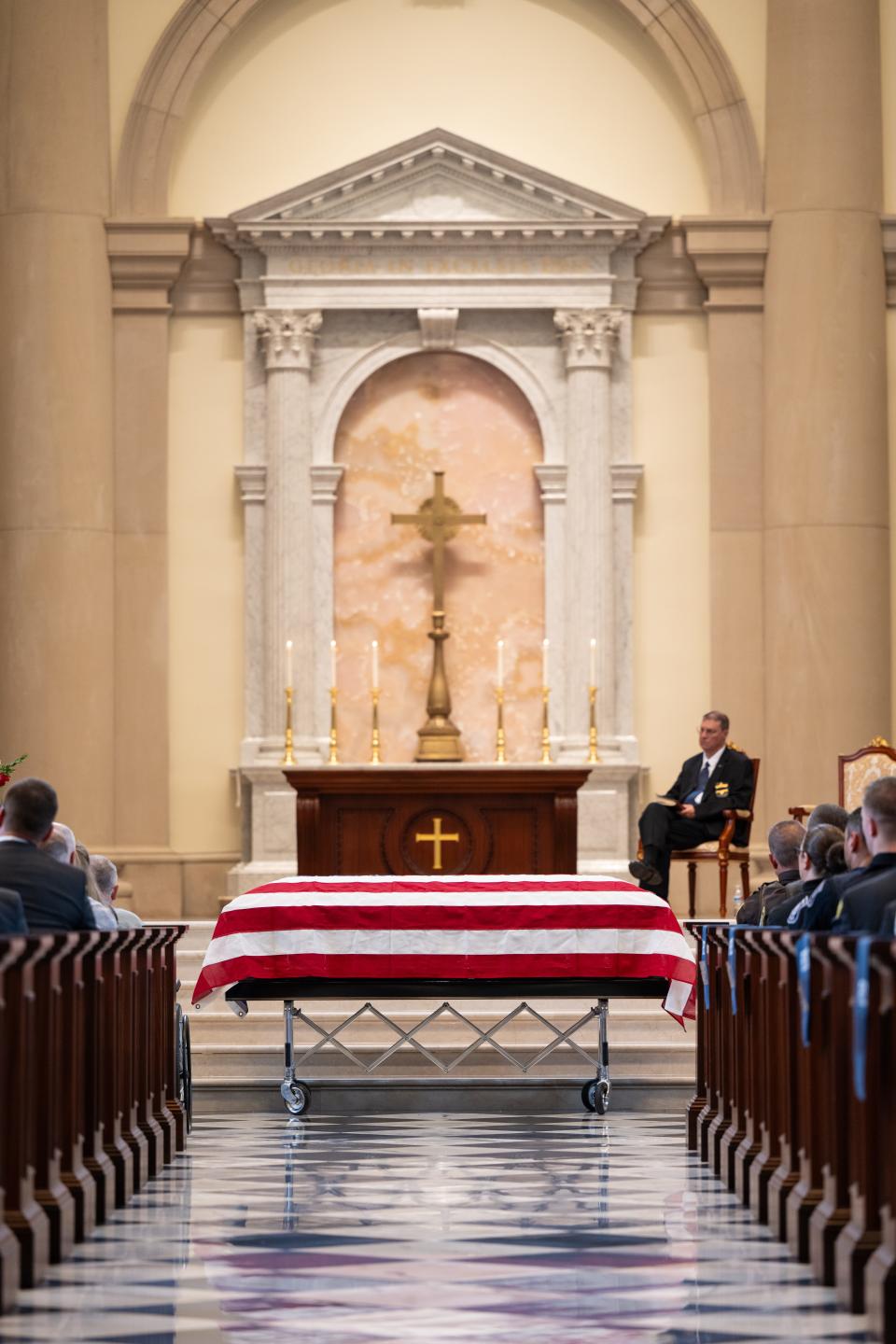 The flag-draped casket of Hillsdale County Deputy William Butler Jr. is pictured during his funeral Wednesday at Christ Chapel at Hillsdale College.