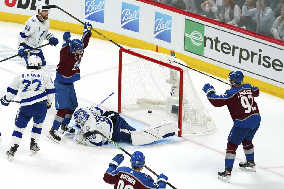 Colorado Avalanche left wing Artturi Lehkonen raises his stick after a goal against Tampa Bay Lightning goaltender Andrei Vasilevskiy (88) during the first period of Game 1 of the NHL hockey Stanley Cup Final on Wednesday, June 15, 2022, in Denver. (AP Photo/John Locher)