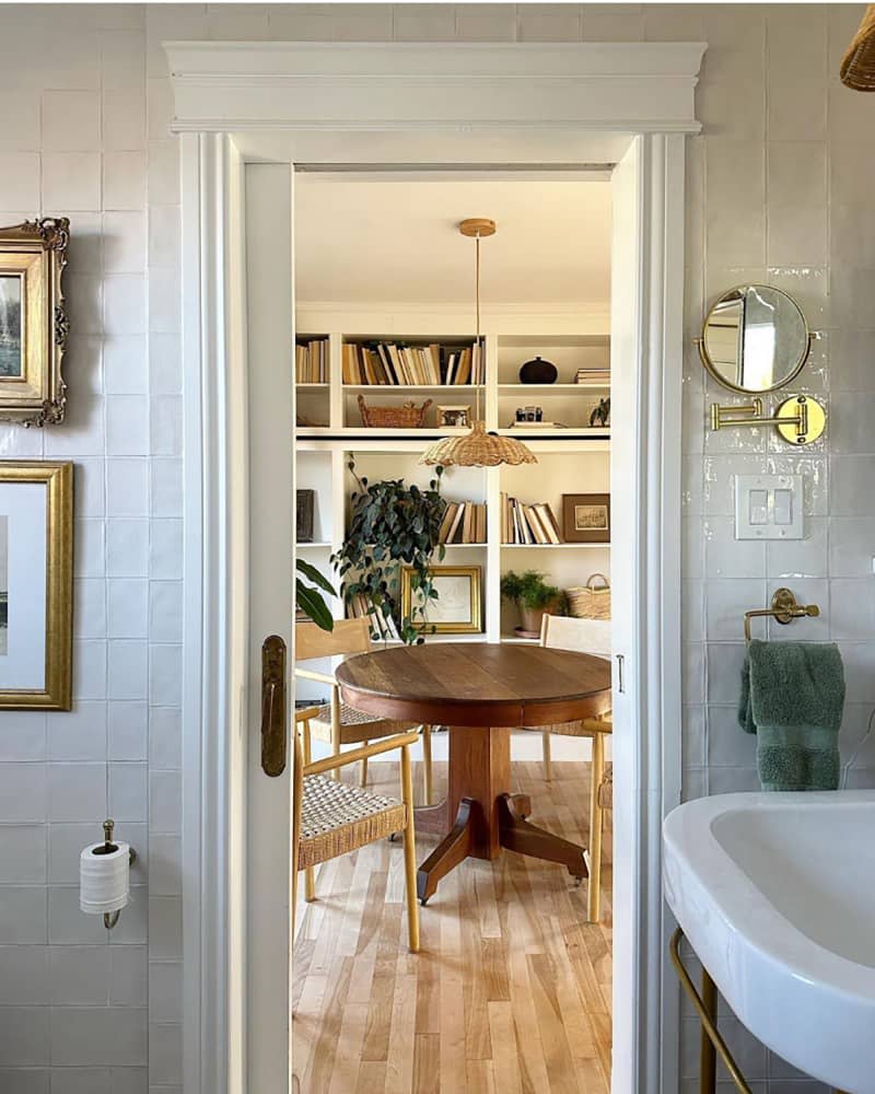 View into newly renovated dining room from renovated bathroom.