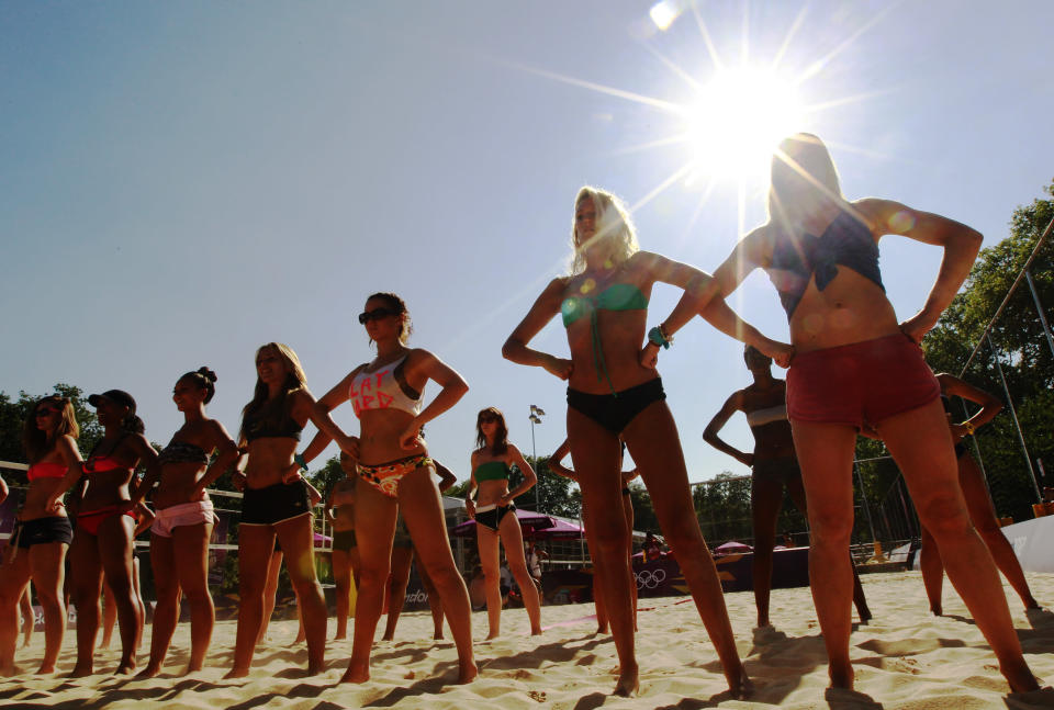 Dancers rehearse their performances for the London 2012 Olympic Beach Volleyball matches at the practice facility near to Horse Guards Parade in London July 24, 2012. (REUTERS/Luke MacGregor)