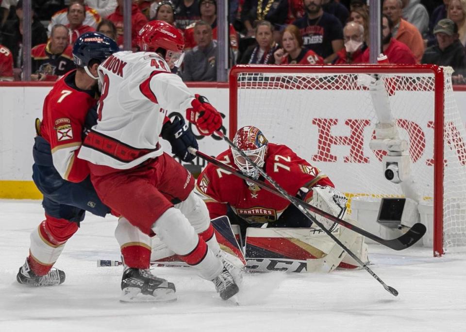 The Florida Panthers Radko Gudas (7) defends the Carolina Hurricanes Jordan Martinook (48) as he tries to shoot on Panthers goalie Sergei Bobrovsky (72) in the first period of Game 4 of the Eastern Conference Finals on Wednesday, May 24, 2023 at FLA Live Arena in Sunrise, Fla.