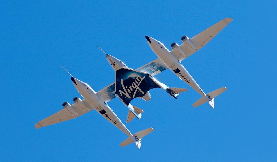 In this Feb. 13, 2020, file photo, Virgin Galactic's VSS Unity departs Mojave Air & Space Port in Mojave, Calif. for the final time as Virgin Galactic shifts its SpaceFlight operations to New Mexico.