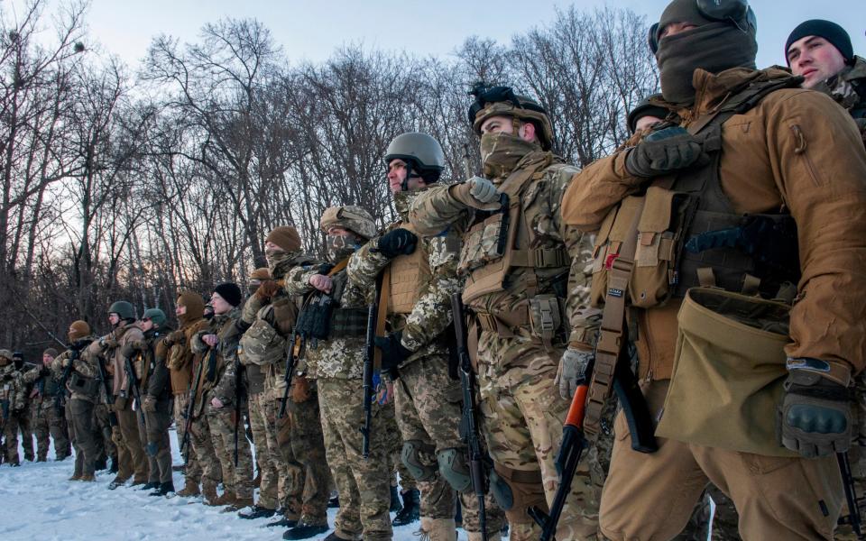 Ukrainian servicemen during a training session outside Kharkiv - Andrew Marienko /AP