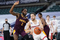 Fairfield's Caleb Green, right, dribbles past Iona's Asante Gist in the second half of an NCAA college basketball game during the finals of the Metro Atlantic Athletic Conference tournament, Saturday, March 13, 2021, in Atlantic City, N.J. (AP Photo/Matt Slocum)